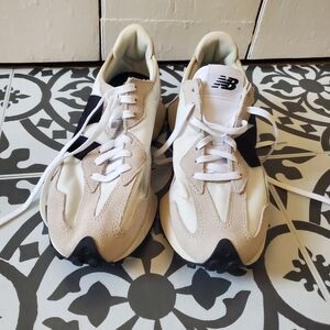 New Balance Cream and Black Sneakers